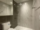 Modern bathroom with a walk-in shower and marble tiles