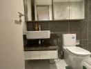 Modern bathroom interior with wall-mounted sink and toilet