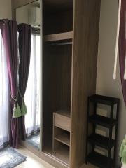 Cozy bedroom interior with wardrobe and shelves