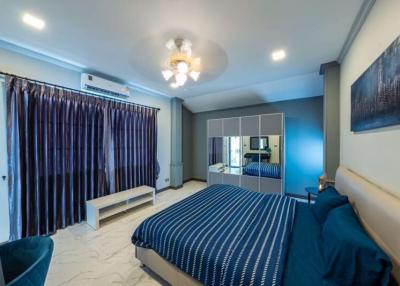 Cozy and modern bedroom with stylish decor and ample lighting