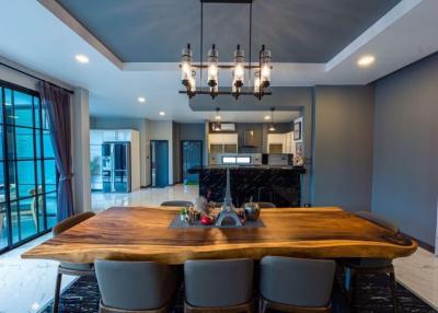 Elegant dining area with custom wooden table and modern lighting