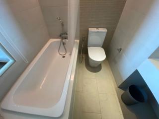 Modern bathroom with bathtub and toilet