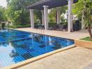 Spacious outdoor area with swimming pool and sitting area