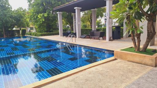 Spacious outdoor area with swimming pool and sitting area