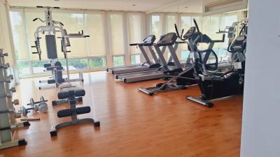 Spacious in-home gym with exercise machines and large windows
