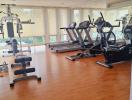 Spacious in-home gym with exercise machines and large windows