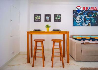 Cozy and modern dining area adjacent to the living room