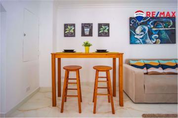 Cozy and modern dining area adjacent to the living room