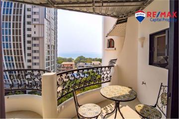 Cozy balcony with a view of the cityscape and a decorative railing