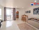 Spacious and well-lit living room with balcony access