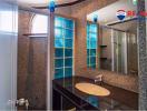 Modern bathroom interior with shower and blue glass window