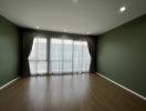 Spacious living room with natural light from large windows