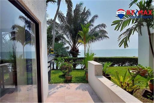 Cozy patio with ocean view and lush greenery