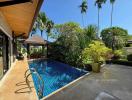 Luxurious private pool with tropical garden in a residential property