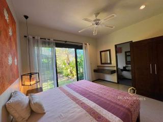 Cozy bedroom with natural light and garden access