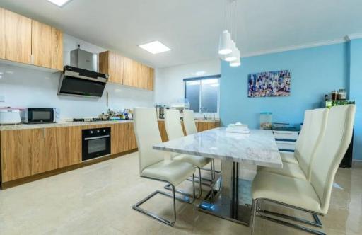 Modern kitchen with dining area in a bright room