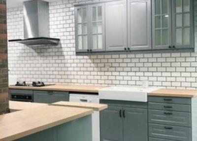 Modern kitchen interior with subway tiles and patterned floor