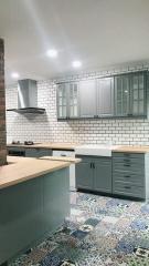 Modern kitchen interior with subway tiles and patterned floor