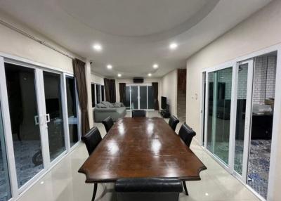 Spacious dining area with large table and open concept layout