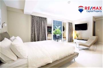 Spacious bedroom with modern design and balcony access