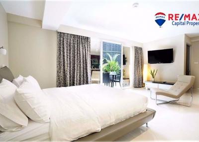 Spacious bedroom with modern design and balcony access