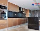 Modern kitchen with stainless steel appliances and ample cabinetry