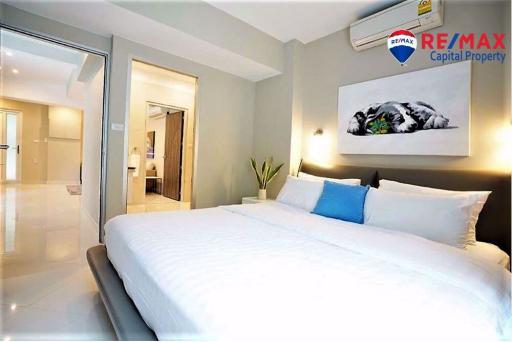 Modern bedroom with sleek design and crisp white bedding