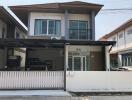 Modern two-story house with garage and balcony