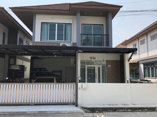 Modern two-story house with garage and balcony