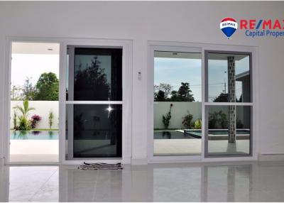 Modern sliding glass doors leading to patio