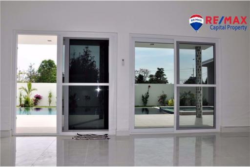 Modern sliding glass doors leading to patio