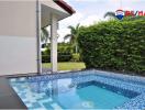 Private swimming pool with garden view at a modern home