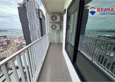 Spacious balcony with ocean view and air conditioning units