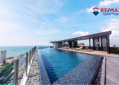 Rooftop infinity pool with ocean view and lounge area