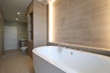Modern bathroom with bathtub and ambient lighting
