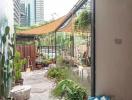 Cozy outdoor patio with garden and city background