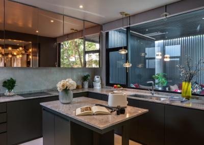 Modern kitchen with stainless steel appliances and elegant decor