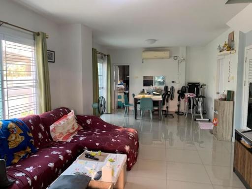 Spacious living room connected to dining area with ample natural light