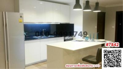 Modern kitchen with white cabinetry and island counter