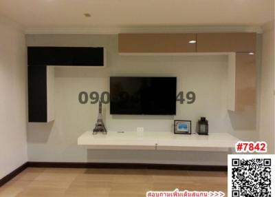 Modern living room with built-in wall units and television