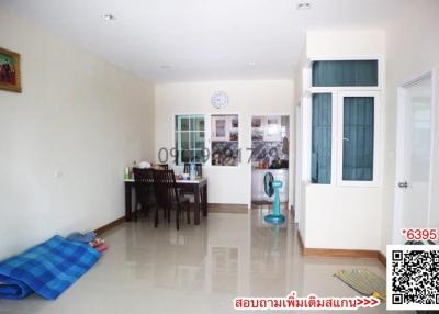 Spacious living area with dining set and tiled flooring