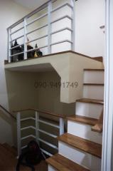 Modern wooden staircase with white accents in a residential home