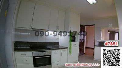 Modern kitchen with white cabinets and built-in appliances