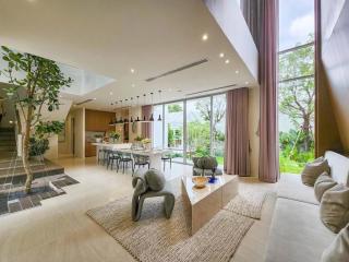 Spacious and modern open concept living room with dining area and kitchen