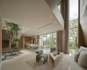 Spacious modern living room with large windows and open-plan design