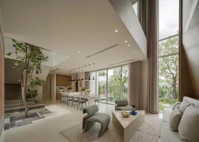Spacious modern living room with large windows and open-plan design