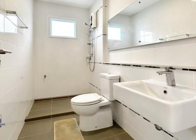 Modern clean bathroom with white fixtures