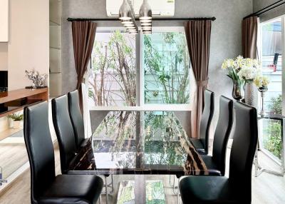 Modern dining room with large windows and natural light