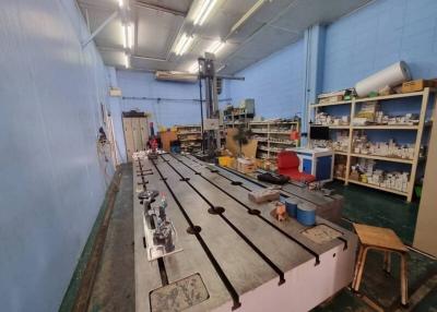 Spacious workshop with machinery and storage shelves