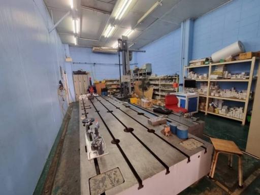 Spacious workshop with machinery and storage shelves